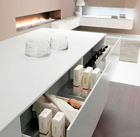 Meseta y muebles de cocina a medida en Corian.