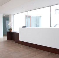 Wood and Corian reception, countertop and furniture. Jove morgue. Gijn.